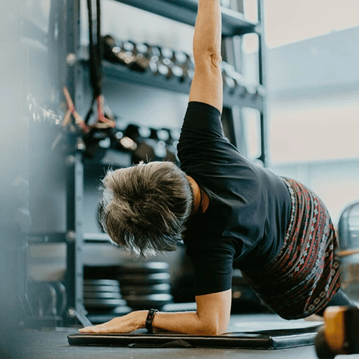 old woman stretching